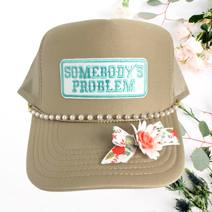 SOMEBODY'S PROBLEM TRUCKER HAT