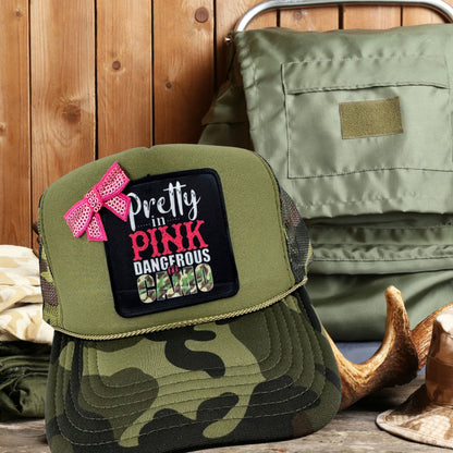 PRETTY IN PINK, DANGEROUS IN CAMO TRUCKER HAT